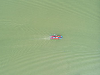 High angle view of boat floating on lake