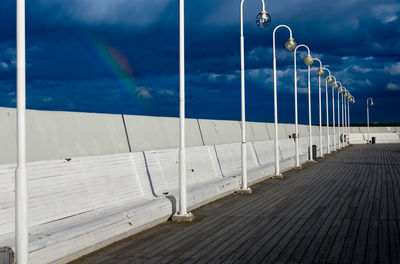 Rainbow on cloudy sky over pier in sopot, poland