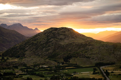 Scenic view of mountains against sky during sunset