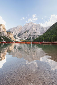 Scenic view of lake and mountains against sky