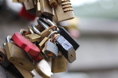 Close-up of padlocks hanging on metal