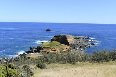 Scenic view of sea against clear blue sky