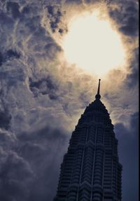 Low angle view of building against cloudy sky