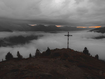 Scenic view of mountains against sky at dusk