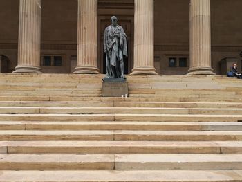 Low angle view of statue against cloudy sky