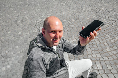 Portrait of a handsome hipster man. a man in a big city with smartphone, a life style concept