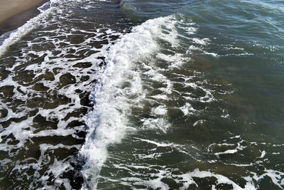 High angle view of water splashing in sea