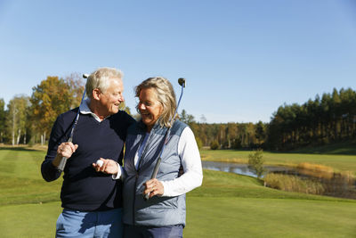 Senior couple on golf course