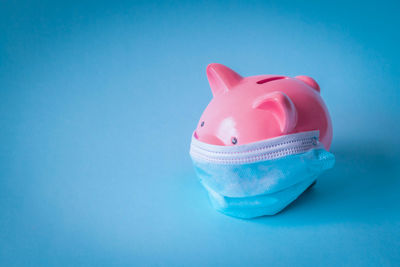 Close-up of pink toy against blue background