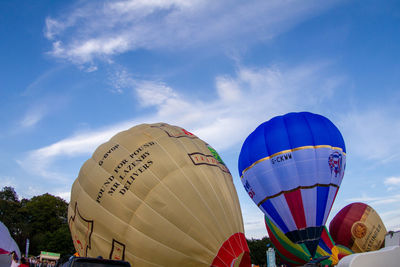 Low angle view of hot air balloons against sky