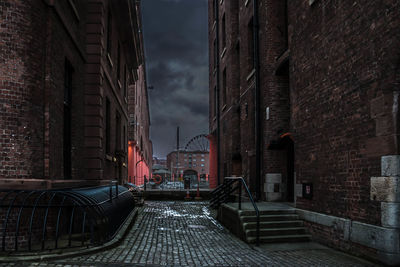 Alley amidst buildings in city