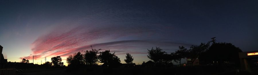 Silhouette of trees against sky at sunset