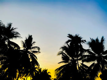 Low angle view of silhouette trees against sky during sunset