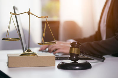 Close-up of clock on table