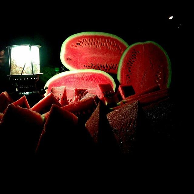 night, red, close-up, metal, no people, indoors, illuminated, dark, animal representation, focus on foreground, still life, protection, art and craft, sunlight, arts culture and entertainment, hanging, chair, art, table