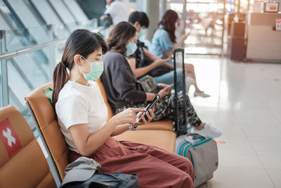 Group of people using mobile phone