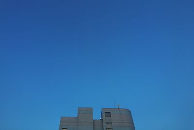 Low angle view of building against blue sky