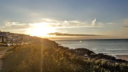 Scenic view of sea against sky at sunset