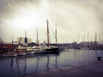 Boats moored at harbor