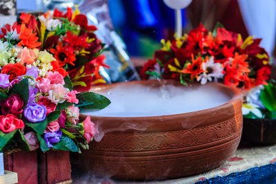 Close-up of roses in vase on table