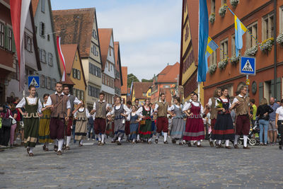 People walking on street in city