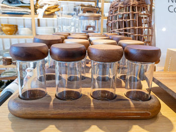 Salt and pepper glass bottles with wooden tops. high quality photo