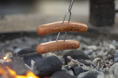 Close-up of sausage over the bonfire