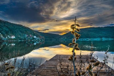 Scenic view of lake against cloudy sky