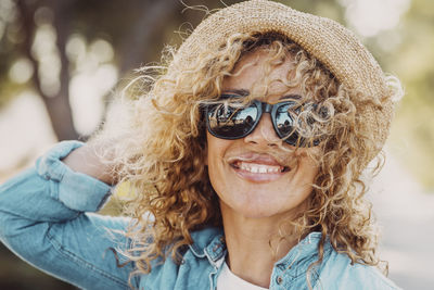 Portrait of young woman wearing sunglasses