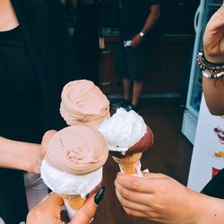 Midsection of woman holding ice cream