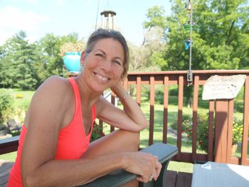 Portrait of smiling young woman sitting outdoors