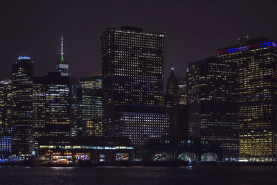 Illuminated buildings in city at night