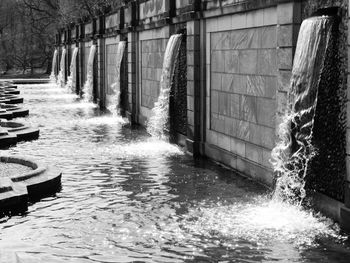 Water flowing from wall fountain