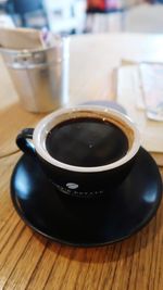 Close-up of coffee cup on table