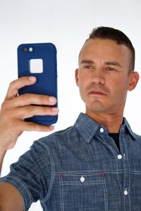 Close-up of man using mobile phone