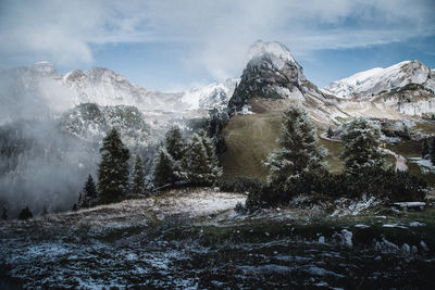 Scenic view of snowcapped mountains against sky