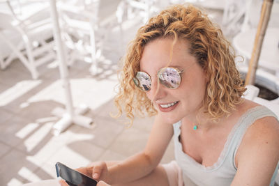 Young woman using mobile phone