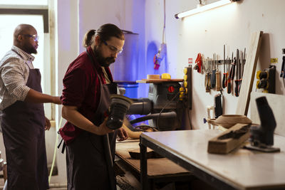 Side view of business colleagues working on table