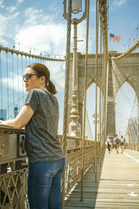 Full length of woman on bridge against sky