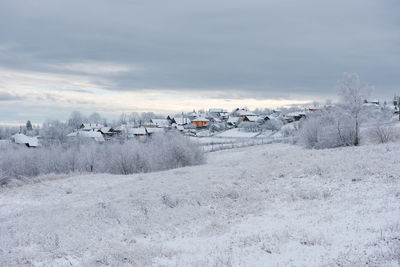 Alpine village in transylvania, romania. snow covered houses in wintertime