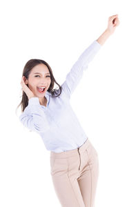 Portrait of a smiling young woman against white background