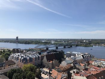 High angle view of river in city against sky