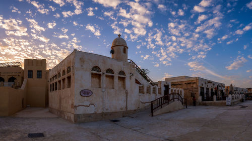 Exterior of old building against sky in city