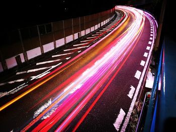 High angle view of light trails on road at night