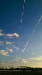 Scenic view of landscape against blue sky