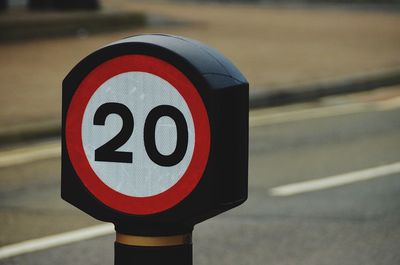 Close-up of road sign on street