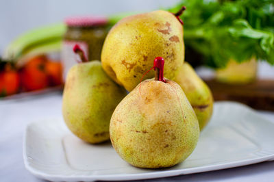 Close-up of fruits in plate on table