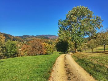 Scenic view of land against clear blue sky