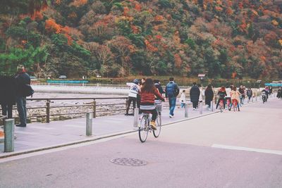 People riding bicycle on road