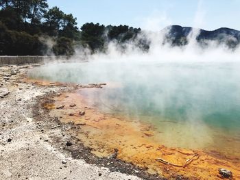 Scenic view of smoke emitting from water